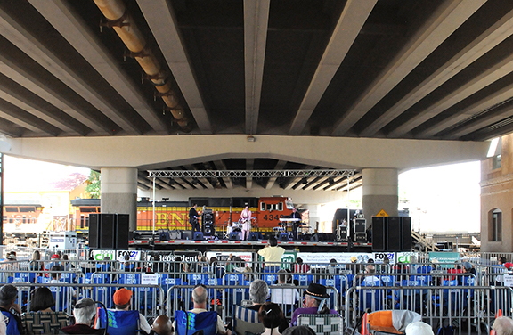 train behind stage at blues under the bridge